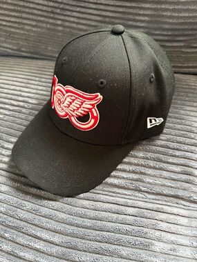 New Era Black Cap with Red and White Wings Logo